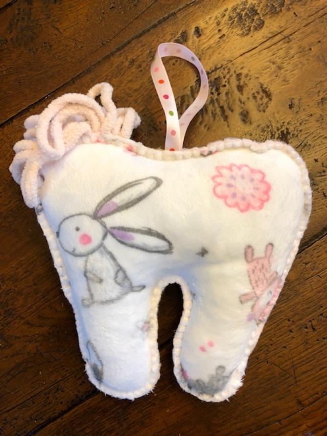 A tooth-shaped pillow